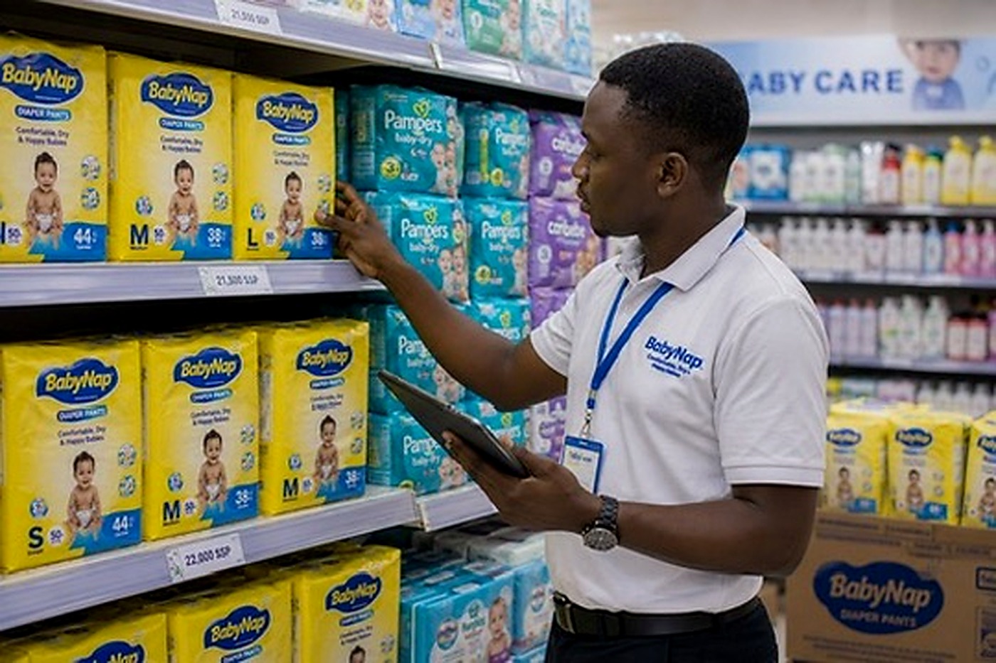 BabyNap promoter checking shelf visibility and merchandising